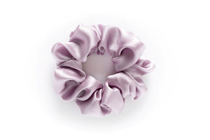 Lavender 100% mulberry silk scrunchie for anti frizz, anti breakage, hair benefits. Celebrates the wonder of natural hair by providing superior quality, professional hair products for women to achieve healthy, long, strong natural hair. Made in Toronto. 